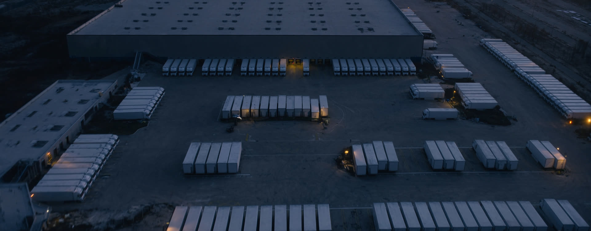 A distribution yard seen from above before dawn